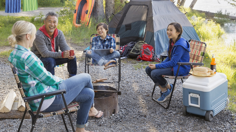 Family camping with cooler