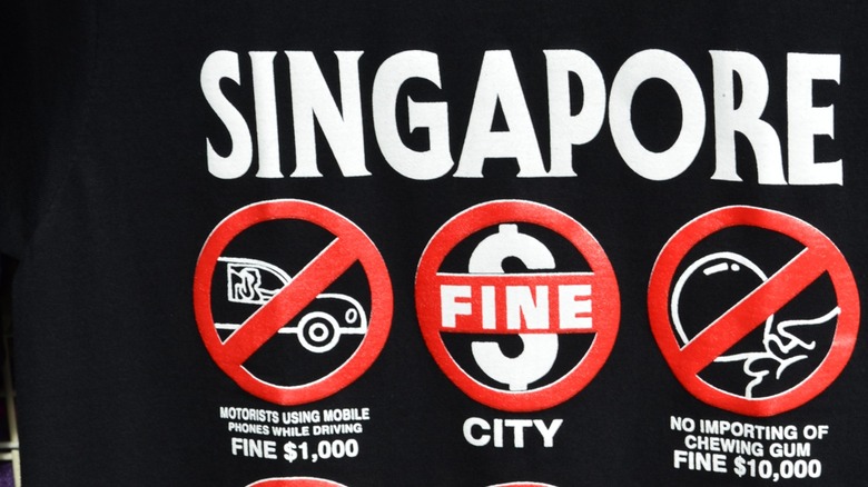 Shirt with a print of various Singaporean bans