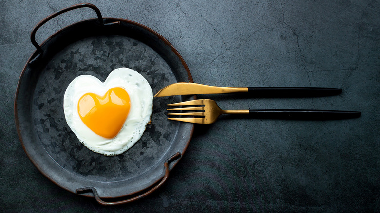 Heart-shaped egg in pan