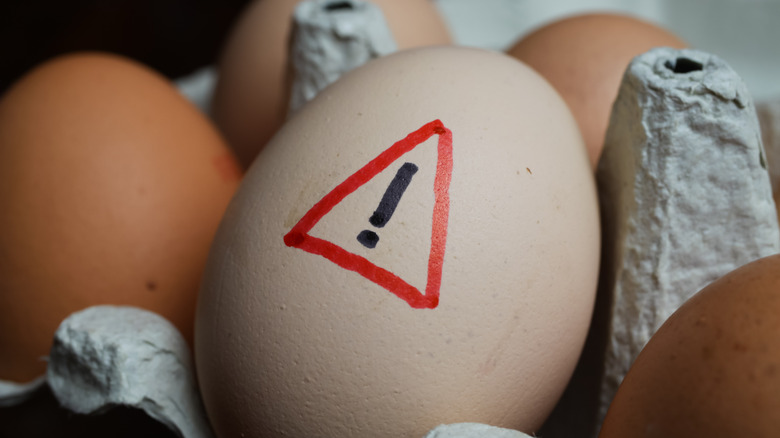 Egg with warning sign