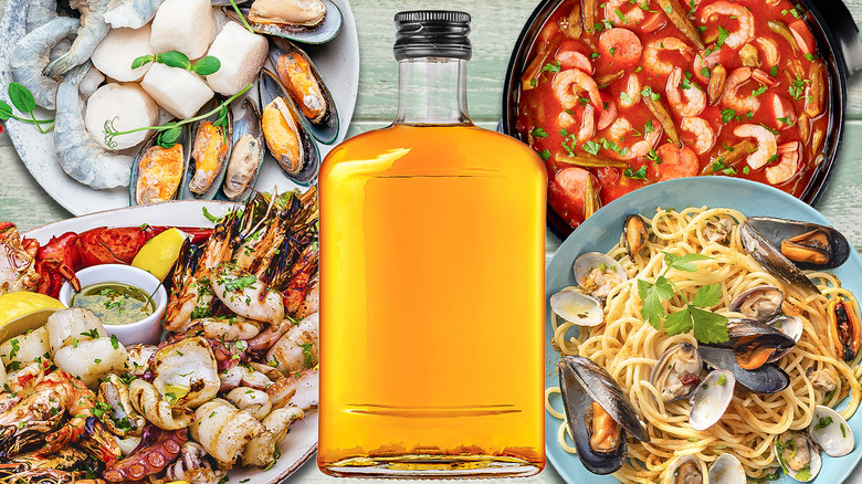 Bottle of bourbon with seafood dishes