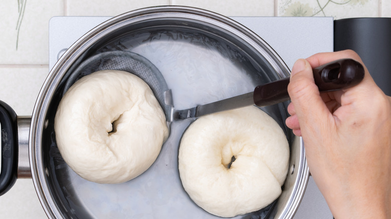 Boiling bagels in pot 