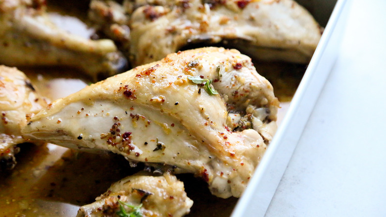 cooked baked chicken in pan