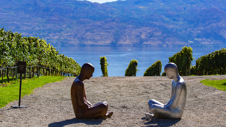 statues overlooking lake