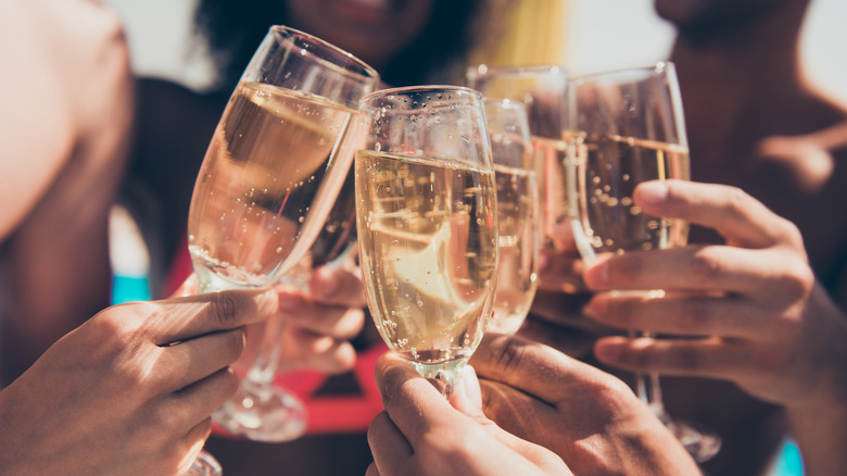 People toasting with sparkling wine