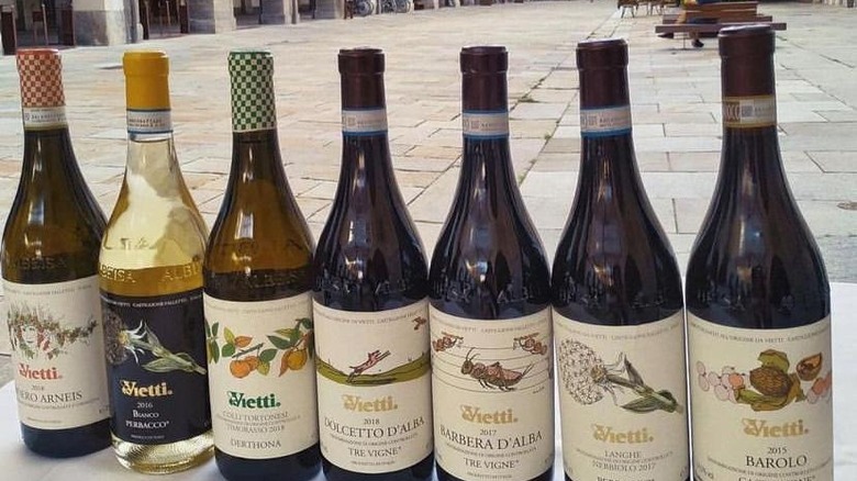 Seven Vietti wine bottles in a row