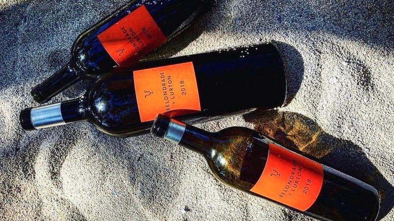 Bottles of Belondrade y Lurton in sand