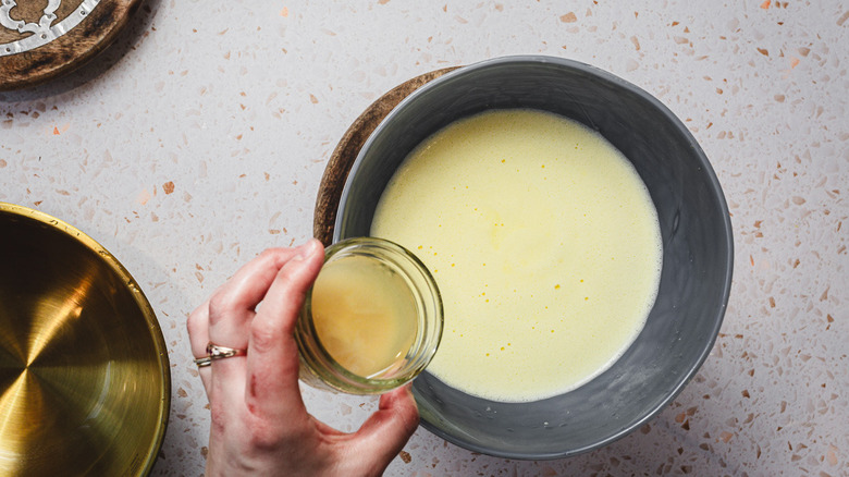 Adding lemon juice to lemon ice cream base