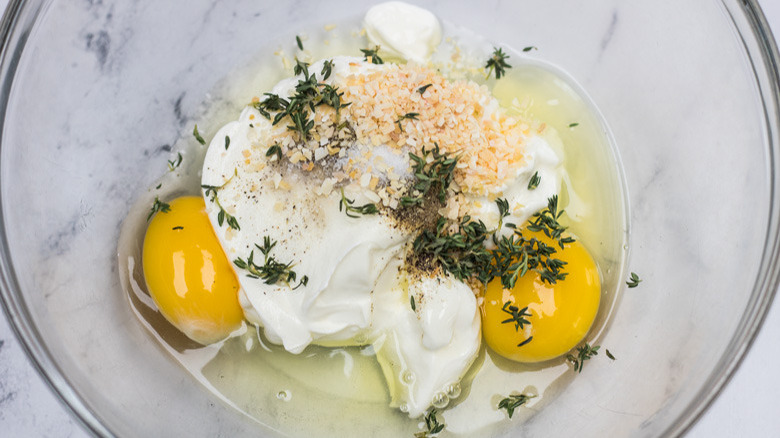 sour cream and eggs in glass bowl