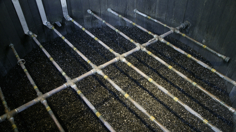 charcoal in wooden vat