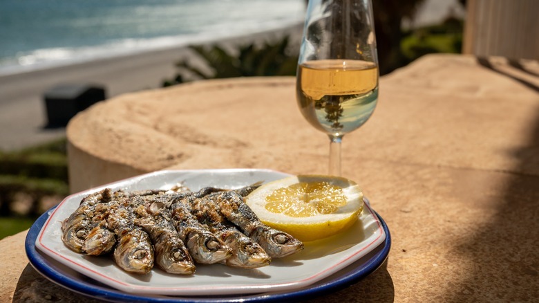 Cooked sardines overlooking a beach