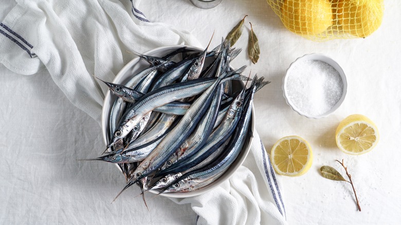 Sardines with lemon on table