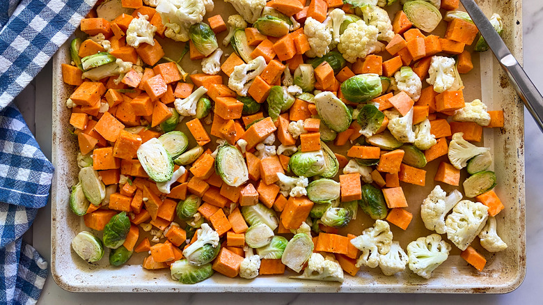 brussels sprouts sweet potatoes on pan