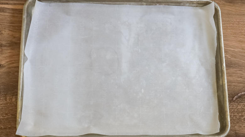 cookie sheet lined with parchment paper