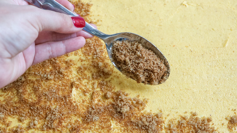 sprinkling sugar on pumpkin puree