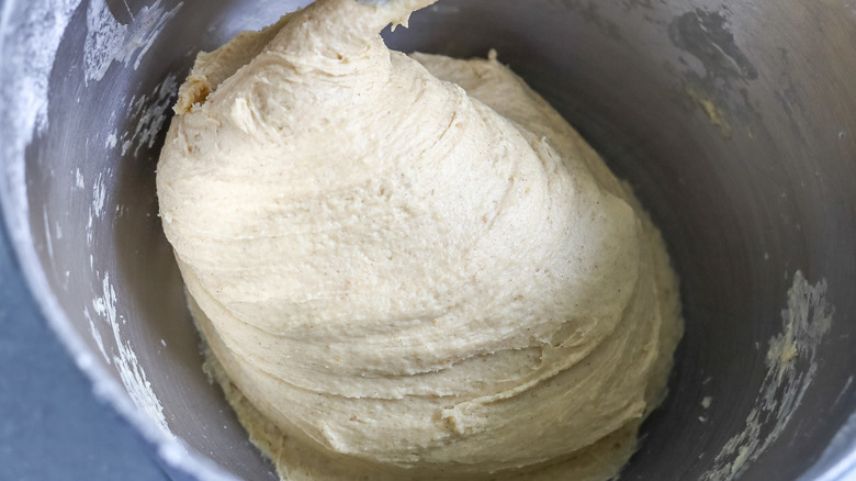 kneaded roll dough in bowl