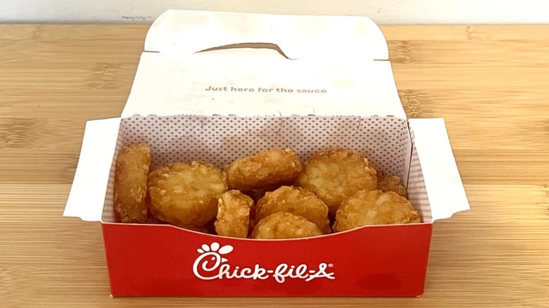 Chick-fil-A hash browns sit on a table.