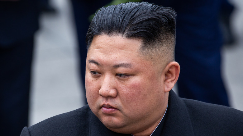 Kim Jong-Un looking left