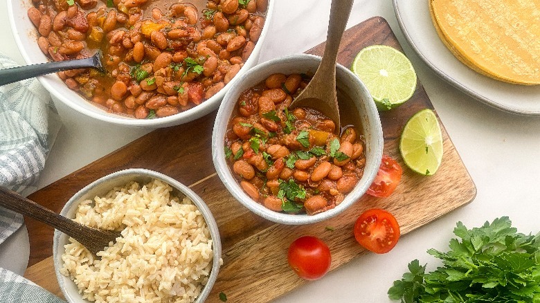 beans and rice in bowls on board