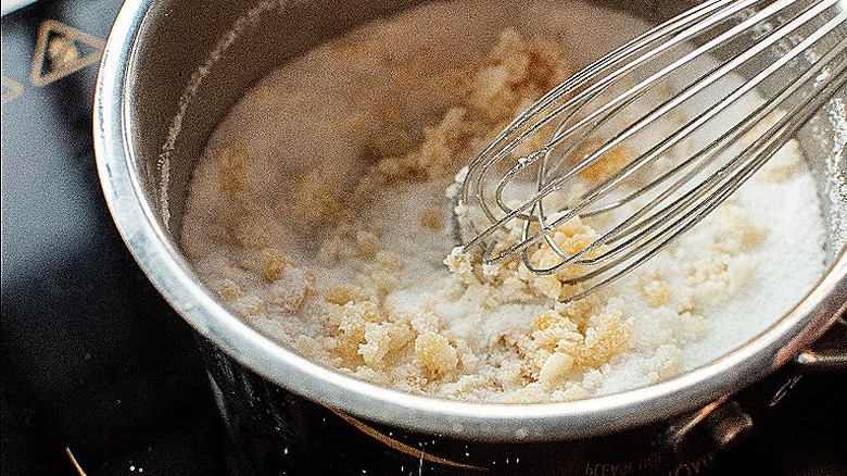 whisking sugars in pot