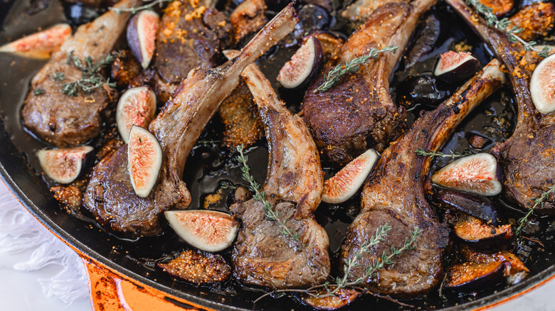 A pan of roasted lamb chops with thyme and figs