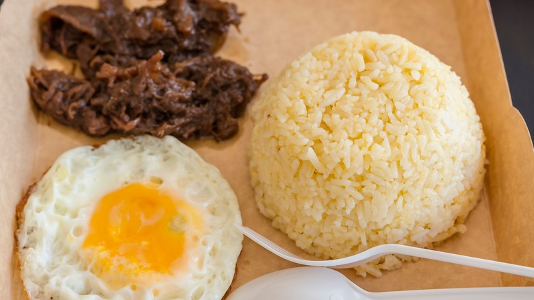 Tapsilog meal on paper plate