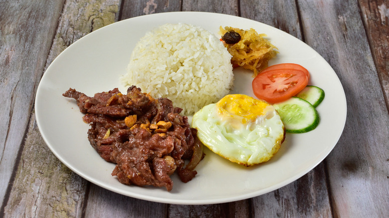 Plated Tapsilog dish with sides