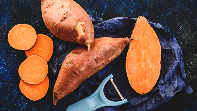 whole and sliced sweet potatoes