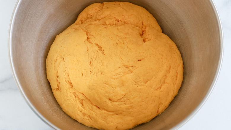 donut dough risen in bowl