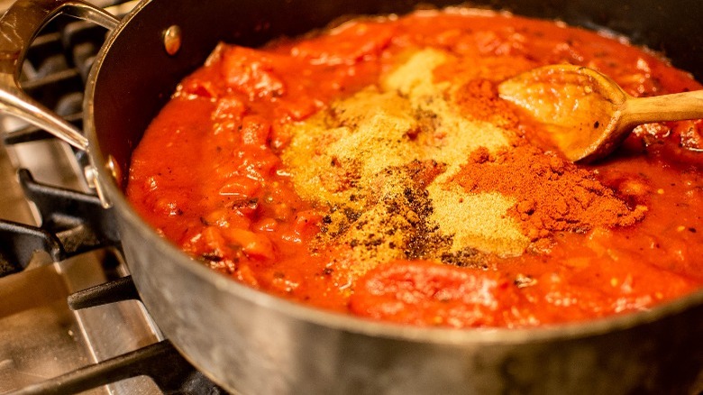 tomato sauce and seasonings in pot