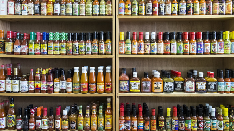 Shelves of hot sauce bottles