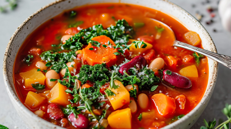vegetable minestrone soup with lots of chunky veg in bowl