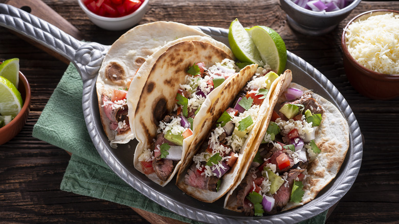 Carne asada tacos with limes