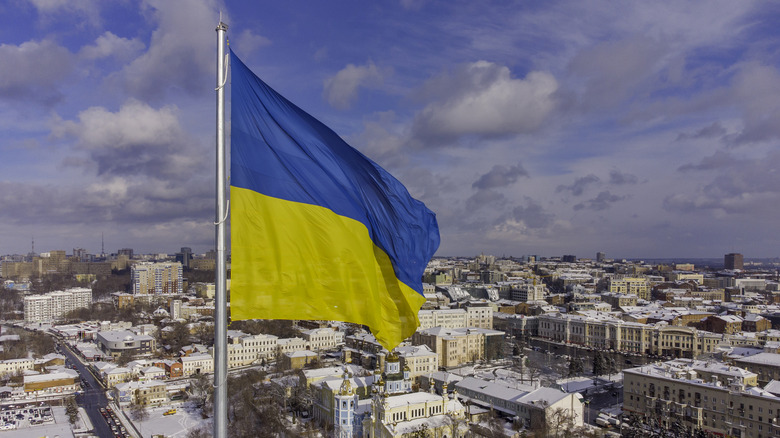 Ukrainian flag over city