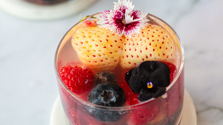 One punch glass with flowers and berries