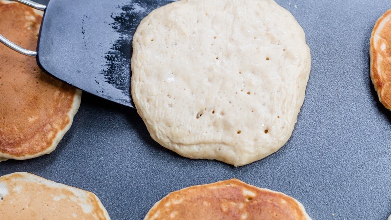 flipping pancakes on griddle