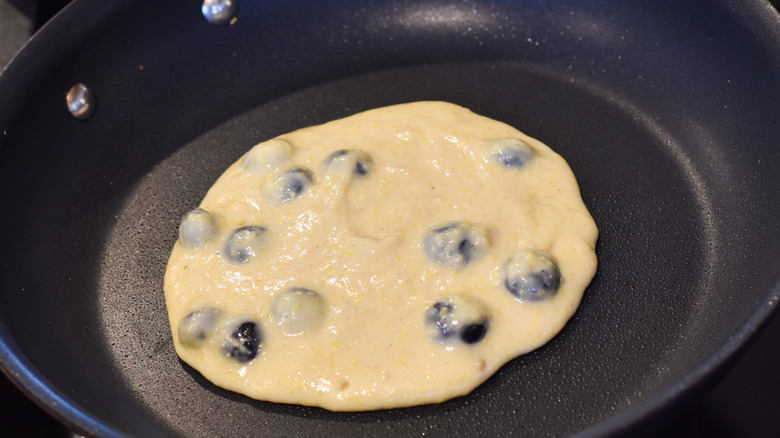 pancakes cooking in pan