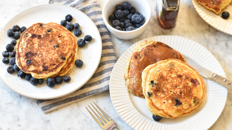 fluffy blueberry cornmeal pancakes plates