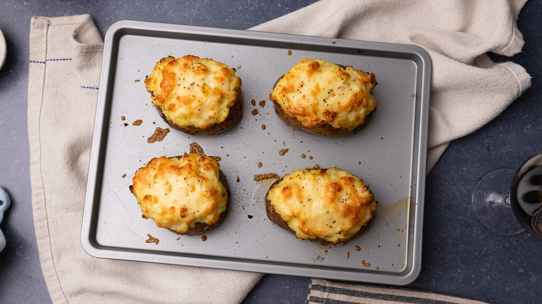 cottage pie baked potatoes on tray