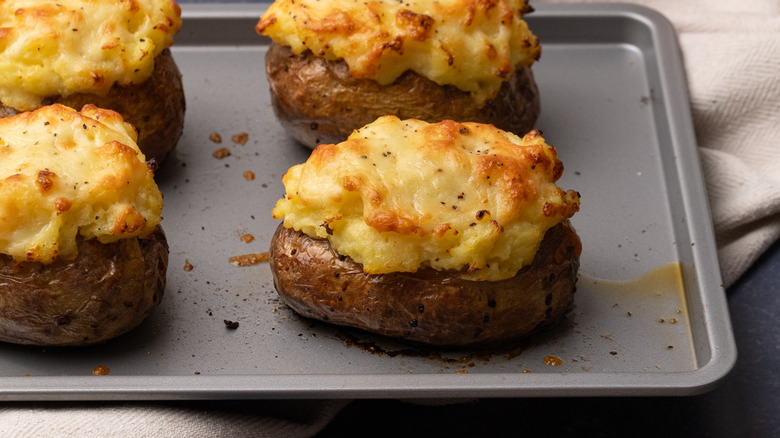 cottage pie baked potatoes on tray