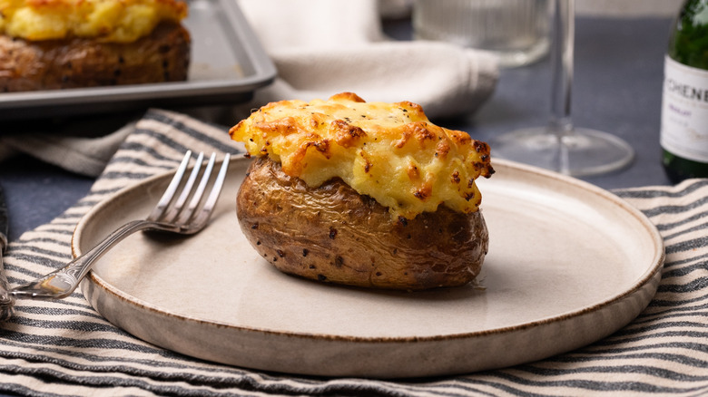 cottage pie baked potatoes on ceramic plate