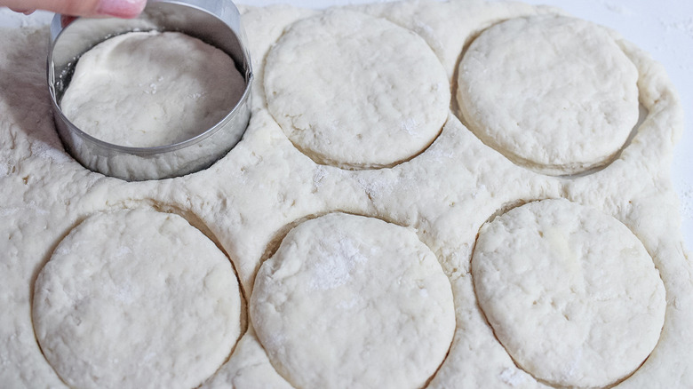 biscuit dough, cutter, and thumb