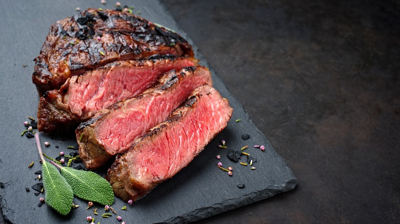 sliced steak on board