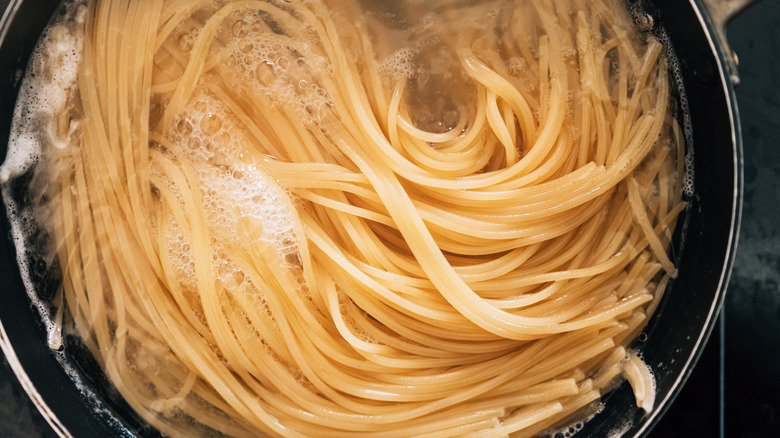 boiling spaghetti in a pot