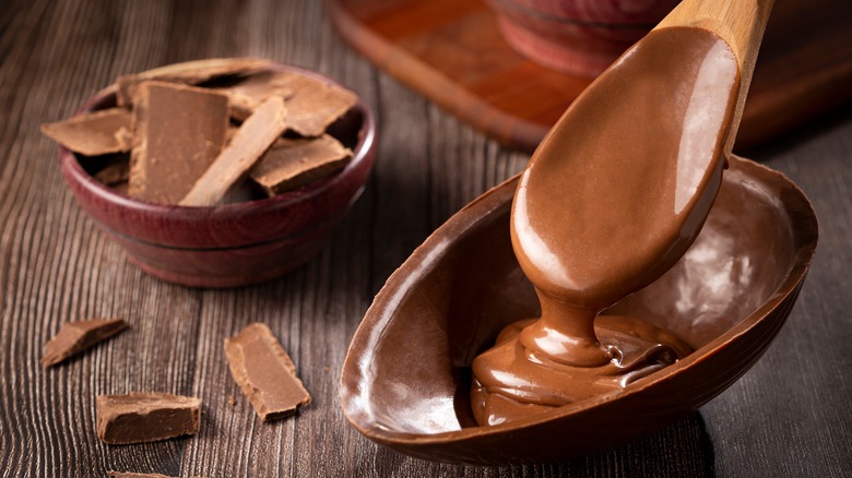 spoon pouring melted chocolate 