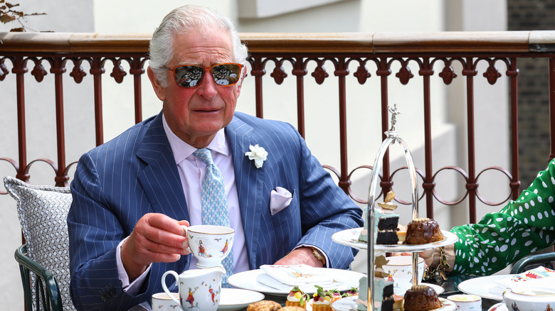 King Charles III drinking tea