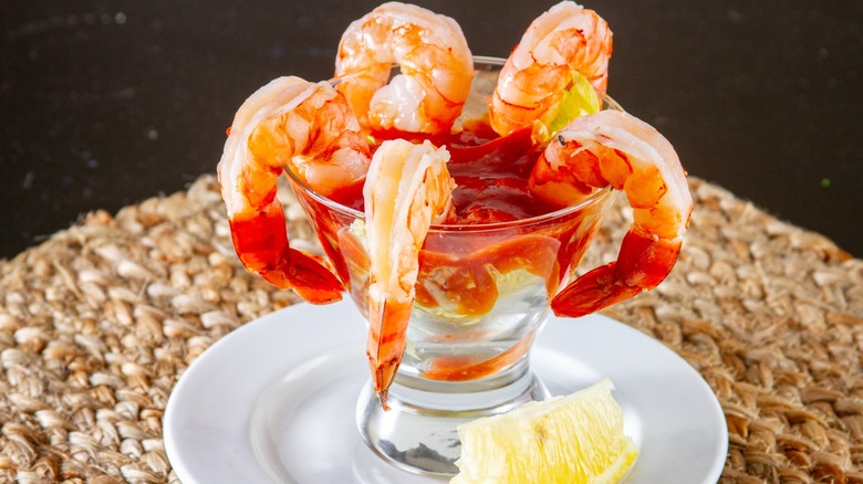 Shrimp cocktail, lemon wedge