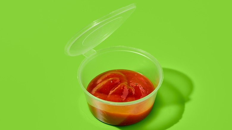 Plastic container of sauce