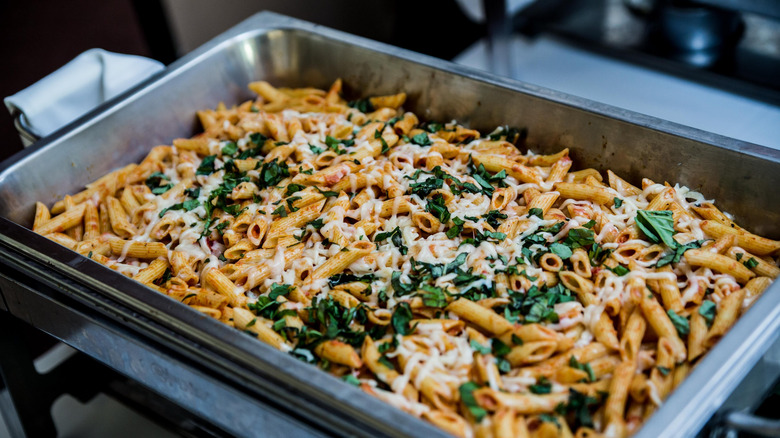 Dish with hot pasta on buffet