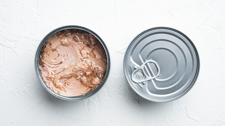 Canned tuna on white background